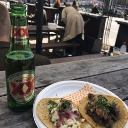 One cheese and one asada taco, both delicious One cheese and one asada taco, both delicious