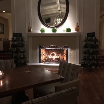 The Conservatory - The special seat for two by the fireplace is a favorite. - New American Near Me - Half Moon Bay, California The Conservatory - The special seat for two by the fireplace is a favorite. - New American Near Me - Half Moon Bay, California