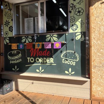 EL Mas Chingon - Food pickup window - connected to covered outdoor seating area. - Food Trucks Near Me - Portland, Oregon