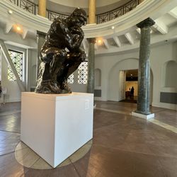 Rodin Sculpture Garden - Auguste Rodin's iconic The Thinker (originating as a figure on The Gates of Hell) is in the West Wing's rotunda entrance