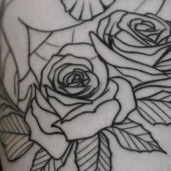 Sueno Tattoo - Close-up of classic rose linework showing bold black outlines with traditional petal structure. Clean lines define the rose blooms - Tattoo Near Me - Silver Spring, Maryland Sueno Tattoo - Close-up of classic rose linework showing bold black outlines with traditional petal structure. Clean lines define the rose blooms - Tattoo Near Me - Silver Spring, Maryland