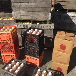 crates of apples and orange juice