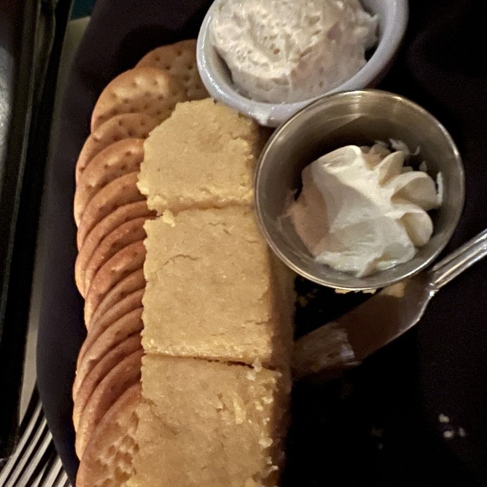 The Parson's Table - Basket of cornbread and crackers for the table (with several slices of cornbread removed) - Steakhouses Near Me - Little River, South Carolina The Parson's Table - Basket of cornbread and crackers for the table (with several slices of cornbread removed) - Steakhouses Near Me - Little River, South Carolina