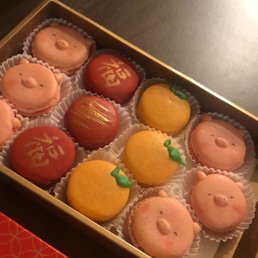 Macaroons for lunar new year , pink were raspy, red were chocolate and orange were orange