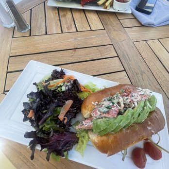 SALT Restaurant and Bar - Forefront: lobster roll and petite salad. Background: swordfish sandwich with fries. - New American Near Me - Marina del Rey, California SALT Restaurant and Bar - Forefront: lobster roll and petite salad. Background: swordfish sandwich with fries. - New American Near Me - Marina del Rey, California