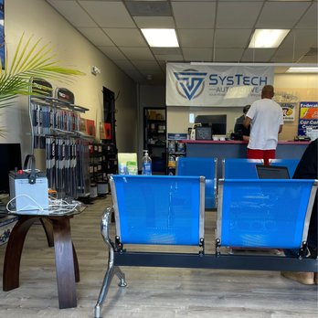 SysTech Automotive - Stylish Blue Clean Seating and Phone Charging Station on Coffee Stand. - Auto Repair Near Me - Fredericksburg, Virginia SysTech Automotive - Stylish Blue Clean Seating and Phone Charging Station on Coffee Stand. - Auto Repair Near Me - Fredericksburg, Virginia