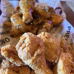 HALF Crispy Fried Chicken (NO SAUCE) and sauces in background HALF Crispy Fried Chicken (NO SAUCE) and sauces in background