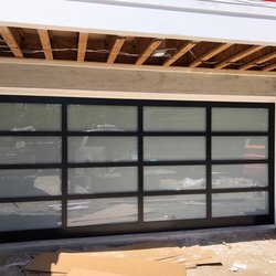 Economy Overhead Garage Doors - 8800 black powder with white laminated glass 6" thick frame