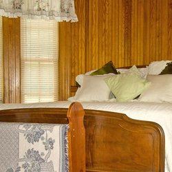 Inn At Smith Cove - Second floor DeFalco Room with queen bed and lake view.