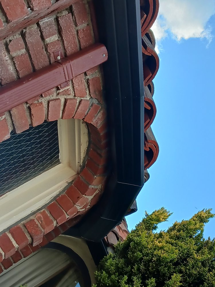 Slide of JB Rain Gutter installation