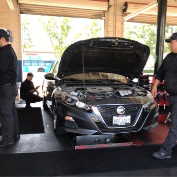 Oil Guys - Topping off one of the fluids. - Oil Change Stations Near Me - Fresno, California Oil Guys - Topping off one of the fluids. - Oil Change Stations Near Me - Fresno, California