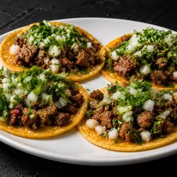 Fuego Cravings - Authentic street tacos topped with fresh cilantro, onions & our signature guac sauce  Bold Mexican flavor made fresh daily