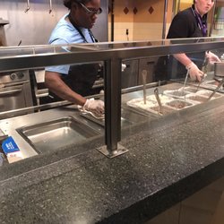 QDOBA Mexican Eats - This lady in the blue shirt refused to serve any of us. Finally her coworker came out and served us.
