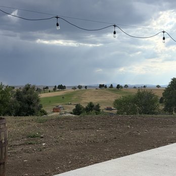 Hairy Cow Brewing Company - View of rainstorm over the Black Hills from patio - Brewpubs Near Me - Box Elder, South Dakota Hairy Cow Brewing Company - View of rainstorm over the Black Hills from patio - Brewpubs Near Me - Box Elder, South Dakota