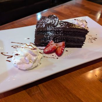 Krave Kitchen & Bar - Chocolate cake (good ganache, v rich) - American Near Me - Woburn, Massachusetts Krave Kitchen & Bar - Chocolate cake (good ganache, v rich) - American Near Me - Woburn, Massachusetts