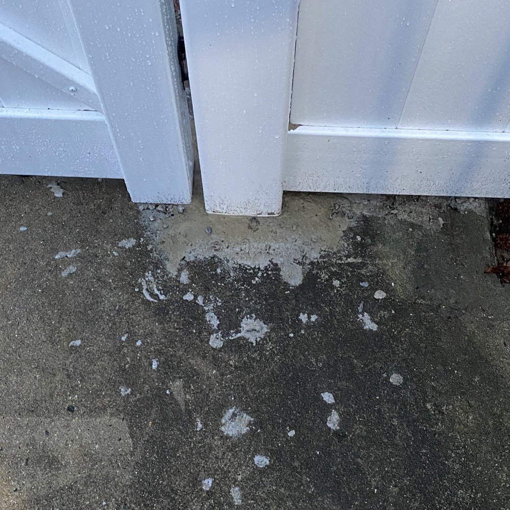 Sloppy cement around posts on my patio. Sloppy cement around posts on my patio.
