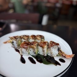 Hot Kiss Roll- I believe this is the hot kiss roll. Shrimp tempura and avocado  inside and fresh water eel on top.