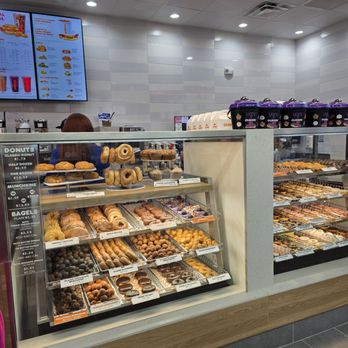 Dunkin' - The donuts display cases, brightly lit up. - Coffee & Tea Near Me - Roanoke, Virginia