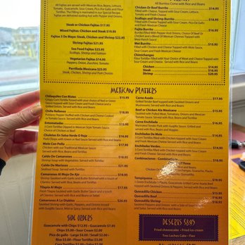 Cinco De Mayo - a person holding a menu - Mexican Near Me - Cape May, New Jersey Cinco De Mayo - a person holding a menu - Mexican Near Me - Cape May, New Jersey