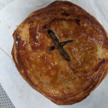 Tí Cafe - Meat pie stamped with their logo. - Coffee & Tea Near Me - Denver, Colorado Tí Cafe - Meat pie stamped with their logo. - Coffee & Tea Near Me - Denver, Colorado