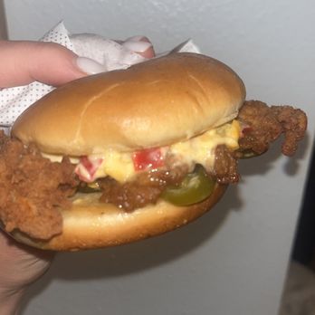 Chick-fil-A - ows a hand holding a sandwich - Fast Food Near Me - Fern Park, Florida