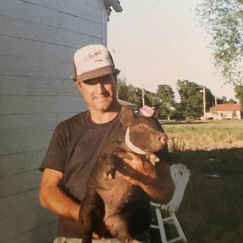 Grandpa Rich's Pork - a man holding a baby pork - Meat Shops Near Me - Topeka, Kansas Grandpa Rich's Pork - a man holding a baby pork - Meat Shops Near Me - Topeka, Kansas