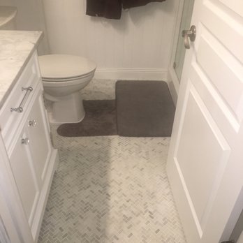 Hale Tile & Stone - Powder bathroom after. White mosaic thassos marble with new vanity and wainscoting installed. - General Contractors Near Me - Aliso Viejo, California Hale Tile & Stone - Powder bathroom after. White mosaic thassos marble with new vanity and wainscoting installed. - General Contractors Near Me - Aliso Viejo, California