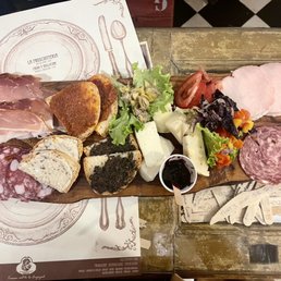 Charcuterie board 10 euros per person. So much food we couldn't finish Charcuterie board 10 euros per person. So much food we couldn't finish