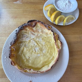 The Original Pancake House - Dutch Baby pancake with lemon wedges and powdered sugar - Pancakes Near Me - Placentia, California The Original Pancake House - Dutch Baby pancake with lemon wedges and powdered sugar - Pancakes Near Me - Placentia, California