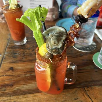 Tiki Tiki - This is their killer Bloody Mary, if you look behind you will see a regular Bloody Mary, only if you dare, its a meal - Burgers Near Me - Hollywood, Florida Tiki Tiki - This is their killer Bloody Mary, if you look behind you will see a regular Bloody Mary, only if you dare, its a meal - Burgers Near Me - Hollywood, Florida