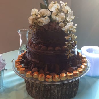 Leon's Pastry Shop - a chocolate cake with flowers on top - Desserts Near Me - Henderson, Texas Leon's Pastry Shop - a chocolate cake with flowers on top - Desserts Near Me - Henderson, Texas