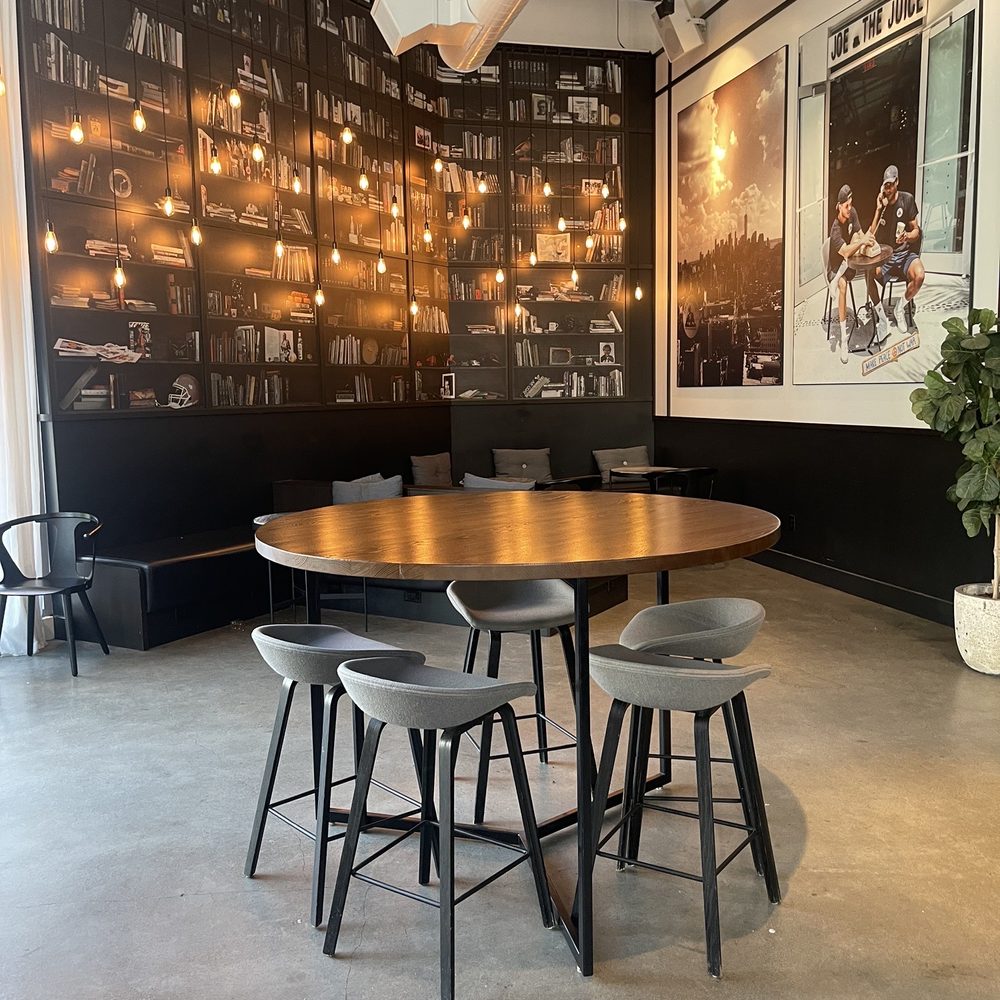 JOE & THE JUICE - a table and chairs in a large room - Coffee & Tea Near Me - San Francisco, California JOE & THE JUICE - a table and chairs in a large room - Coffee & Tea Near Me - San Francisco, California