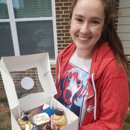 The birthday girl with her cupcakes! The mini donuts on the coffee and donuts cupcakes looked adorable.
