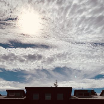 Highside Distilling - Outside patio area, building, and a great sky. - Distilleries Near Me - Bainbridge Island, Washington