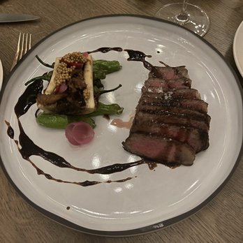 Madam - Wagyu strip loin with ox tail and bone marrow - New American Near Me - Birmingham, Michigan Madam - Wagyu strip loin with ox tail and bone marrow - New American Near Me - Birmingham, Michigan