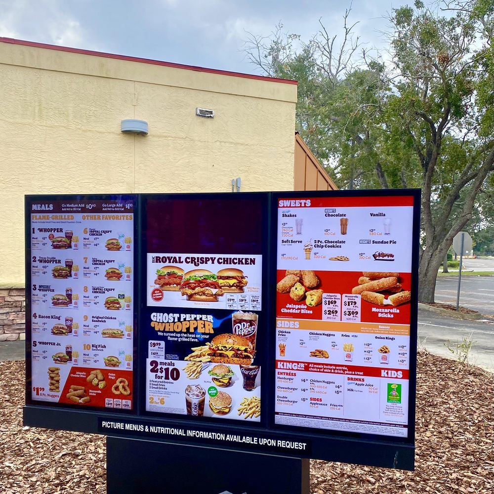 Burger King - menus displayed on a sign in front of a building - Burgers Near Me - Edgewater, Florida