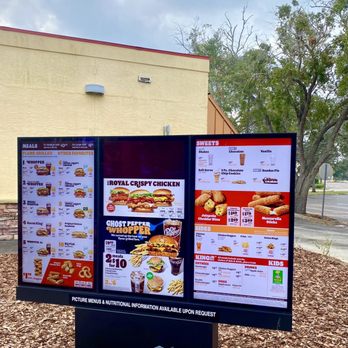 Burger King - menus displayed on a sign in front of a building - Burgers Near Me - Edgewater, Florida