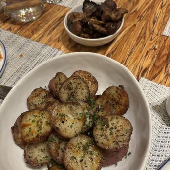 Mama Bird - Grilled Potatoes with mushrooms in the back - Chicken Shop Near Me - Portland, Oregon Mama Bird - Grilled Potatoes with mushrooms in the back - Chicken Shop Near Me - Portland, Oregon