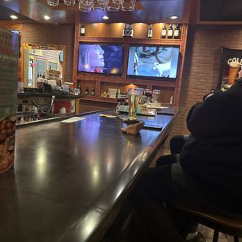 Applebee's Grill + Bar - a man sitting at the bar - Sports Bars Near Me - Mc Minnville, Tennessee