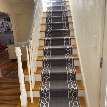 DRV REMODELING & CONSTRUCTION - Removed existing carpeting, installed new stairs without removing banister, painted banister and railing, stained steps and installed runner - General Contractors Near Me