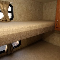 North Shore RV Rental - Interior of Starcraft 26' bunkhouse travel trailer. Rear bunk beds and full bath.