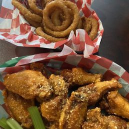 Medium garlic parm wings, extra crispy and Basket of Onion Rings