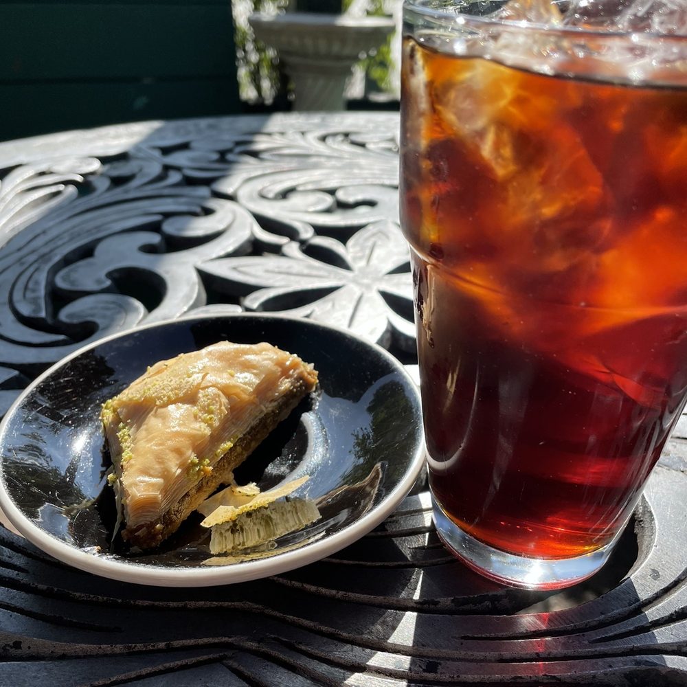 Agora - Black ice coffee  Pistachio baklava - Coffee & Tea Near Me - Houston, Texas