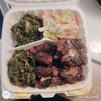 Lucian's Caribbean Grill - Oxtails with cabbage and greens.Amazing. - Caribbean Near Me - Houston, Texas Lucian's Caribbean Grill - Oxtails with cabbage and greens.Amazing. - Caribbean Near Me - Houston, Texas