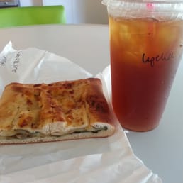 Spinach and mushroom pastry thing and a Lychee iced tea Spinach and mushroom pastry thing and a Lychee iced tea