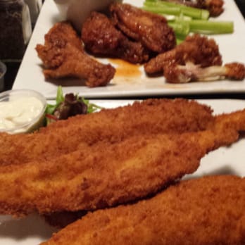 Mo's Seafood - Fried fish wings in the background - Seafood Near Me - Middle River, Maryland Mo's Seafood - Fried fish wings in the background - Seafood Near Me - Middle River, Maryland