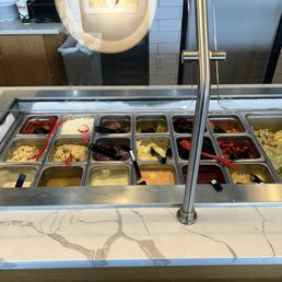 Salad bar didn't look too bad could've been freshened up Salad bar didn't look too bad could've been freshened up