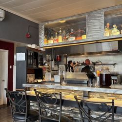 Open concept kitchen with extra chairs at the bar