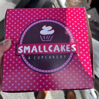 Smallcakes A Cupcakery - a person holding a box - Bakeries Near Me - Albuquerque, New Mexico