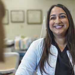 Harbor Dental Center - Dr. Roshni Bhatt, DMD at Harbor Dental, where patients can expect a friendly atmosphere, non-judgmental approach, and plenty of smiles.